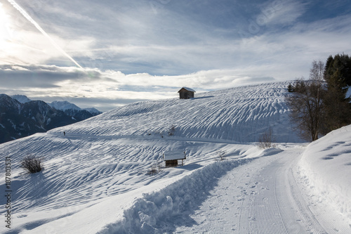 Wooden alpine hut in ski resort Serfaus Fiss Ladis in Austria with snowy mountains
