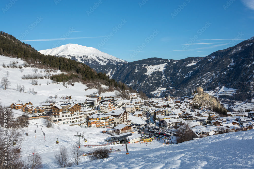 View on the small village Ladis in ski resort Serfaus Fiss Ladis in Austria with snowy mountains