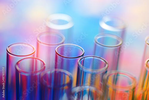 colorful rows of laboratory test tubes , science background
