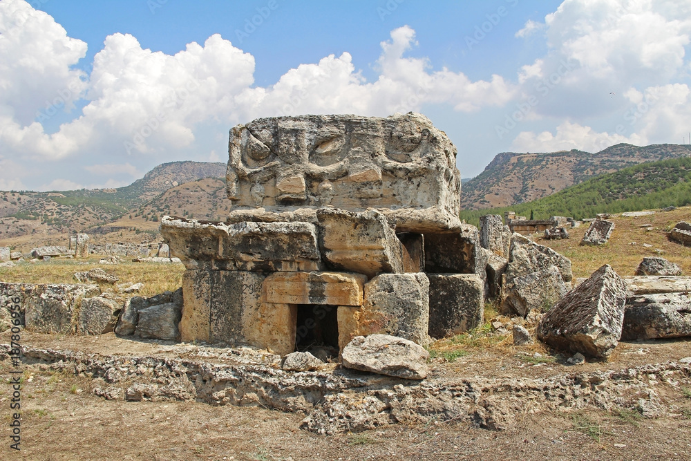 The ruins of the ancient Hierapolis city next to the travertine pools of Pamukkale, Turkey. Tomb.