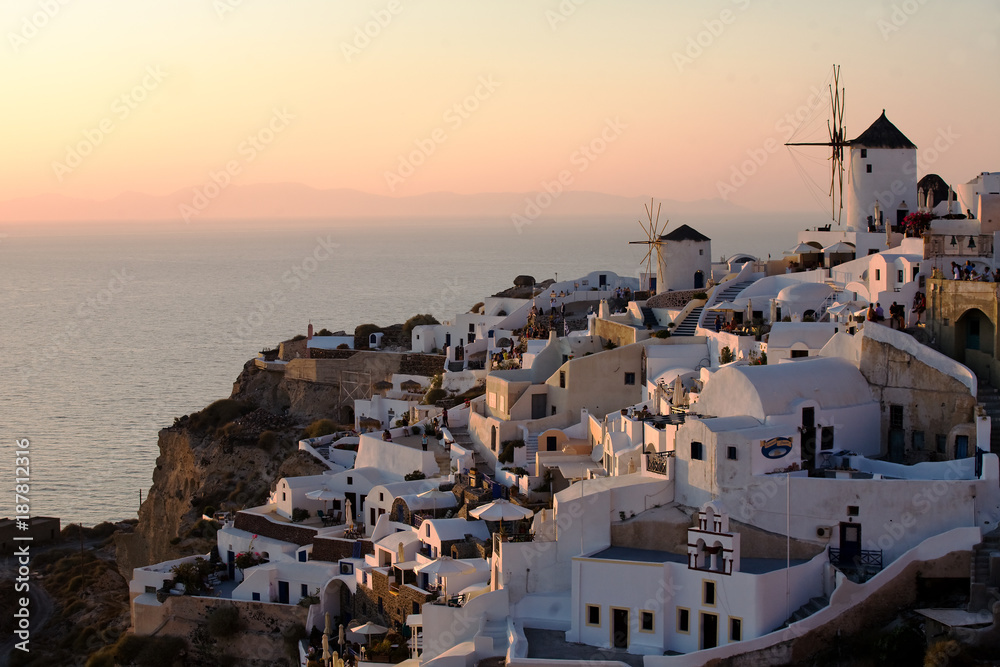 view of Oia village in a beautiful  sunset light,  Santorini island,cyclades, Greece.