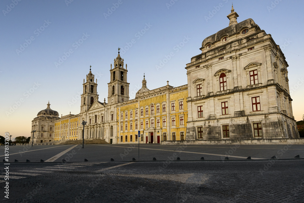 View of the Convent of Mafra at sunset in Mafra, Portugal; Concept for travel in Portugal and most beautiful places in Portugal