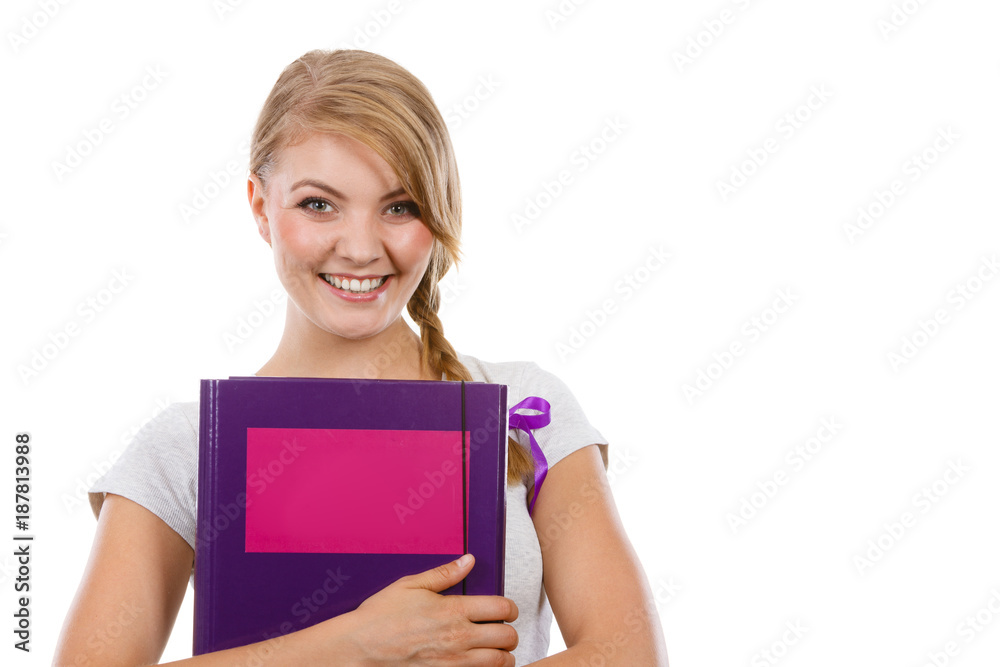 Young teenage student with braid holding books Young teenage student with braid holding books