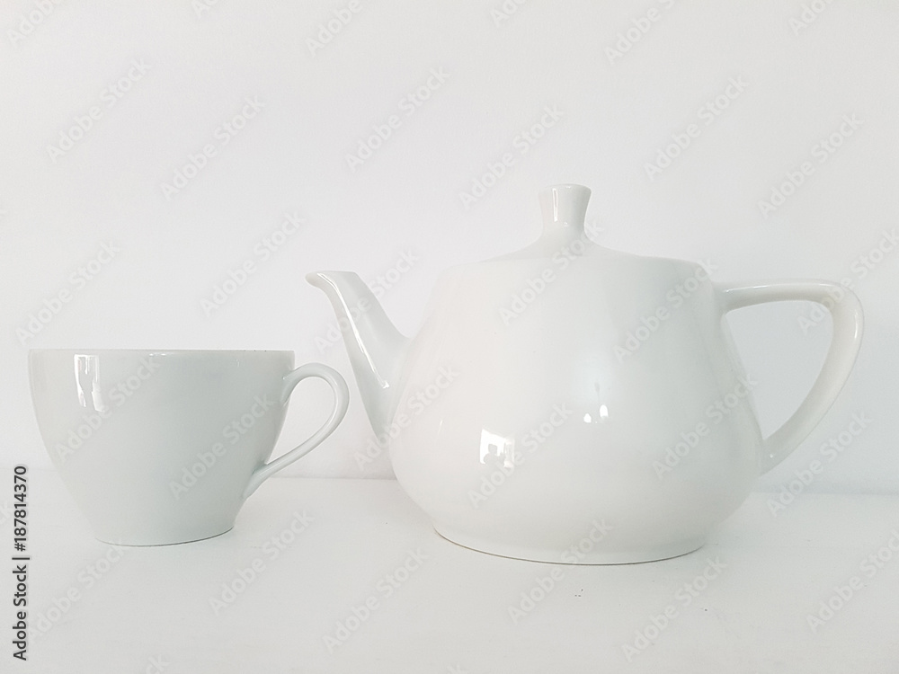 White tea cup and tea pot on white background