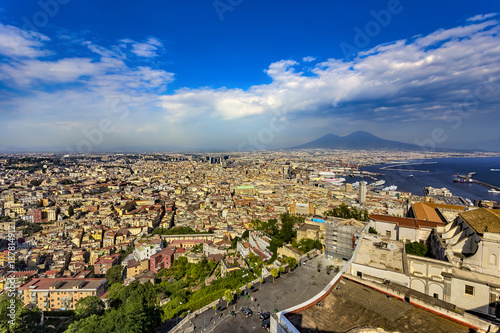 Italy. Cityscape of Naples (historic centre is a UNESCO World Heritage Site) seen from Castle Sant'Elmo. There is Certosa e Museo di San Martino in the right and Mount Vesuvius in the background