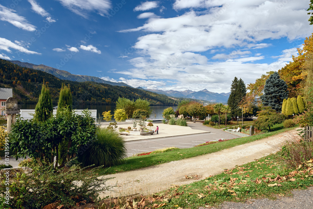 Autumn park on the shore of the Millstaetter lake in the town of Millstatt am See, situated on the southern slope of the Gurktal Alps. Federal state of Carinthia, Austria