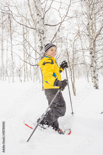 Caucasian boy snowshoeing photo