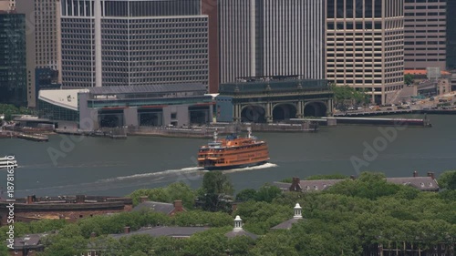 New York City, New York circa-2017, Aerial shot Staten Island Ferry approaching ferry terminal.  Shot with Cineflex and RED Epic-W Helium. 