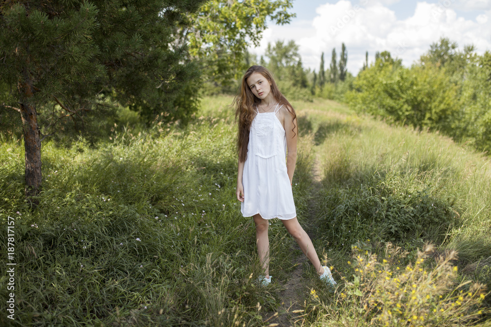 Caucasian girl standing in field of grass Caucasian girl standing in field of grass