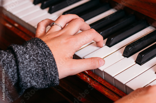 Hands playing the piano