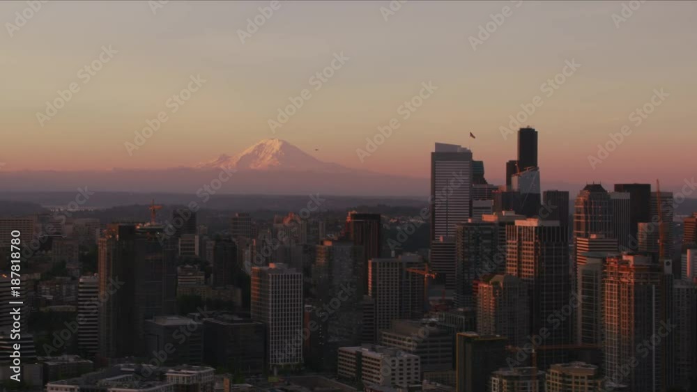 Seattle, Washington circa-2017, Aerial view of Seattle and Mt. Rainier at sunrise. Shot with Cineflex and RED Epic-W Helium. Seattle, Washington circa-2017, Aerial view of Seattle and Mt. Rainier at sunrise. Shot with Cineflex and RED Epic-W Helium.