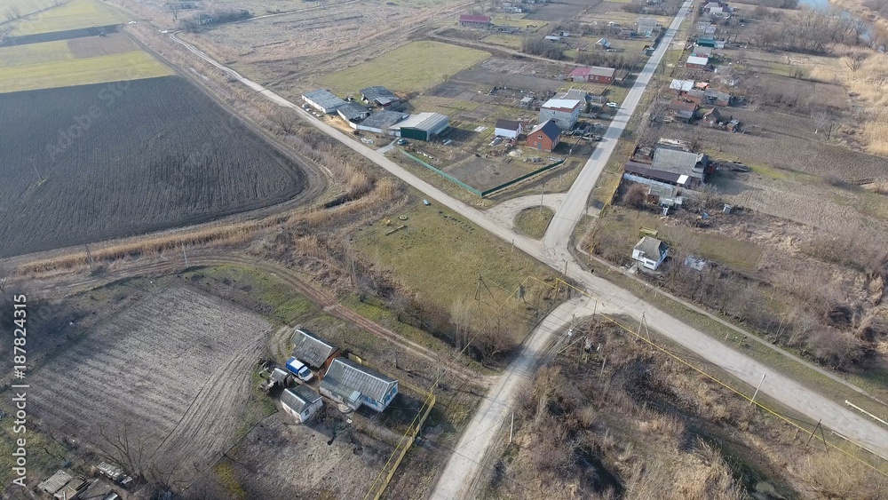View from the top of the village. Streets without asphalt and single-storey houses. The Kuban village.