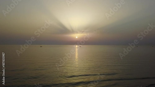 Drone aerial view of the fishing boats pull their nets at the sunrise. Adriatic cost. Emilia Romagna. Italy photo