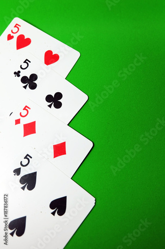5 Playing Card Game. Old Five of Heart, Spades and Diamonds Playing Cards Isolated On Green Background Great for Any Use. photo
