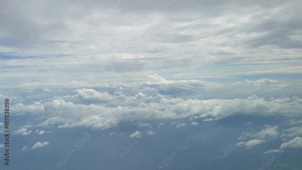 view from aircraft window with blue sky and clouds view from aircraft window with blue sky and clouds