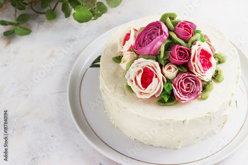 Birthday cake with flowers rose on white background photo