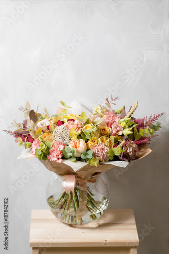 Flower composition on a gray background. Wedding and Festive decor. Bouquet from spring flowers. copy space