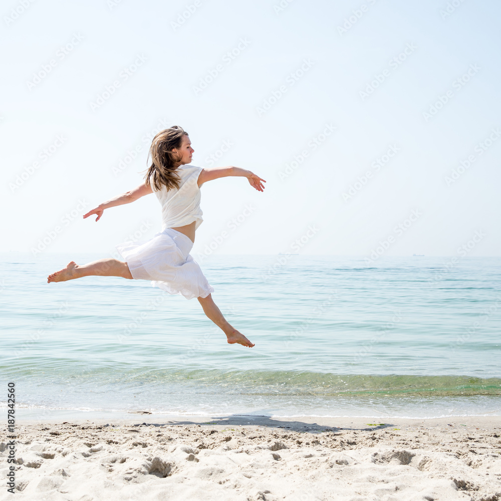 Happy beautiful young girl jumping Happy beautiful young girl jumping