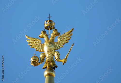 Russian two-headed eagle on top of a tower at the Red square in Moscow. Coat of arms of Russia on the background of clear sky