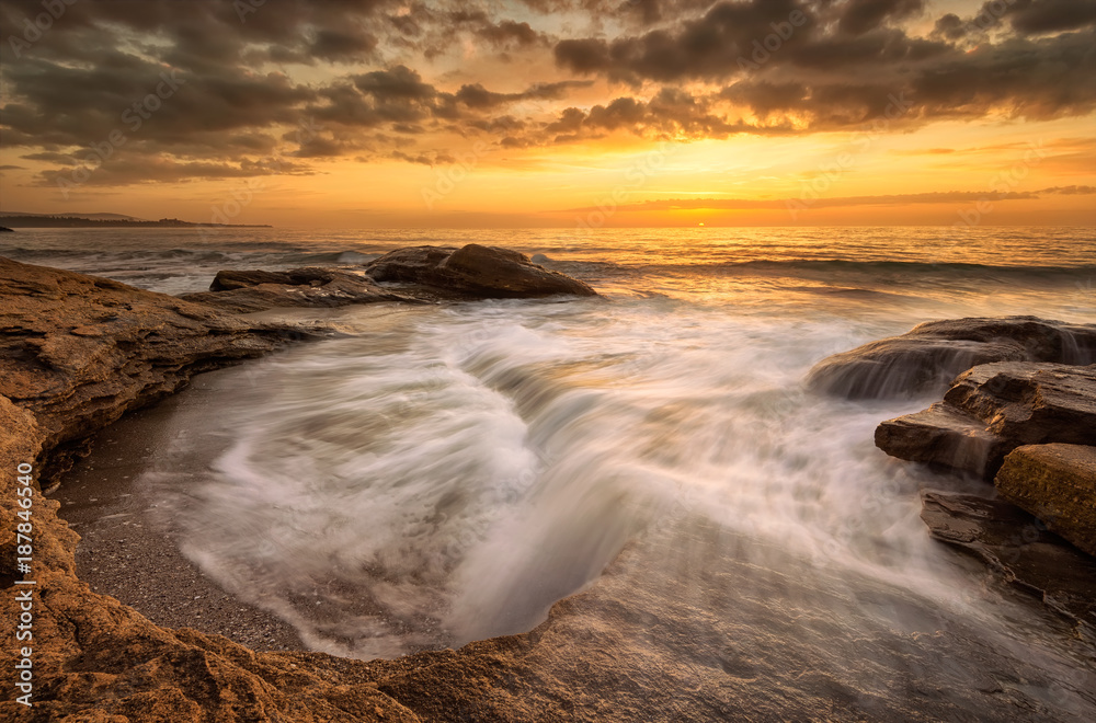 Fototapeta premium Rocky sunrise / A beautiful view with first rays at a rocky Black Sea coast, Bulgaria