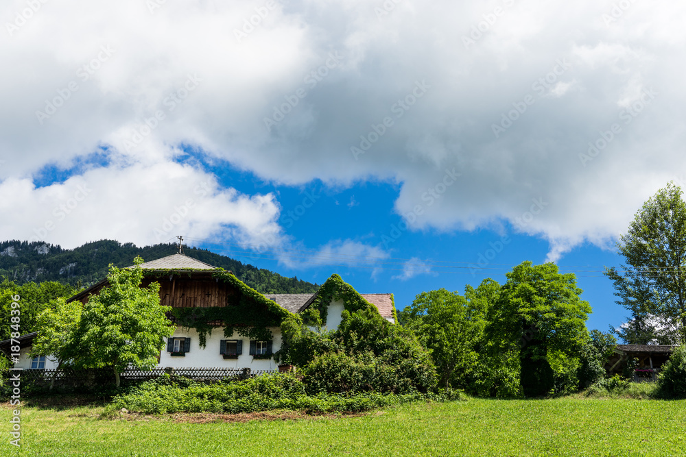 View on austrian alps and traditional buildings