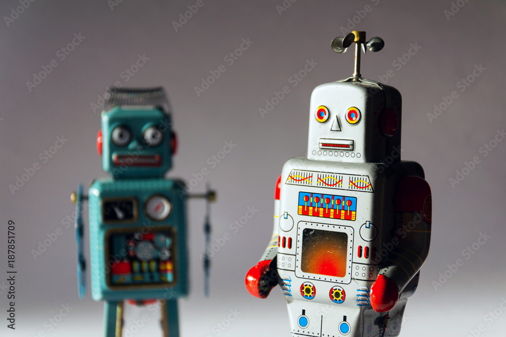 Naklejka premium Angry vintage tin toy robots, artificial intelligence, robotic drone delivery concept