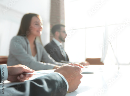 image is blurred. business partners at the meeting