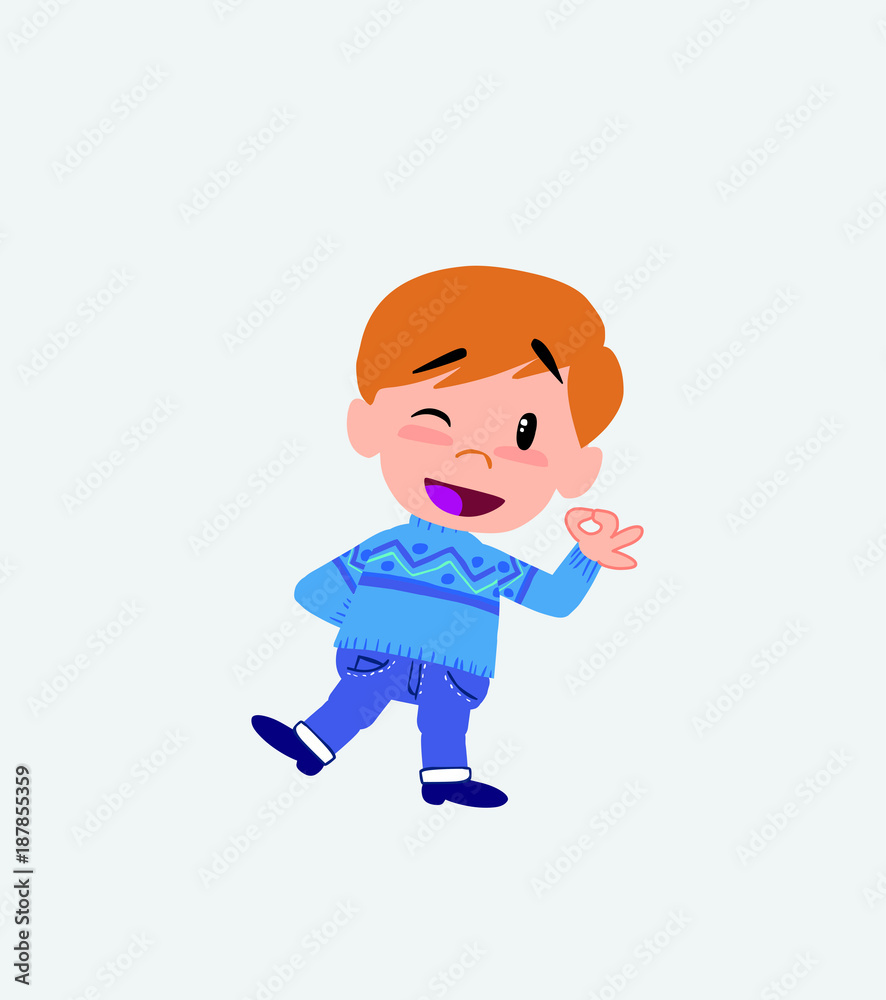 White boy in jeans doing the OK sign with his hand. White boy in jeans doing the OK sign with his hand.