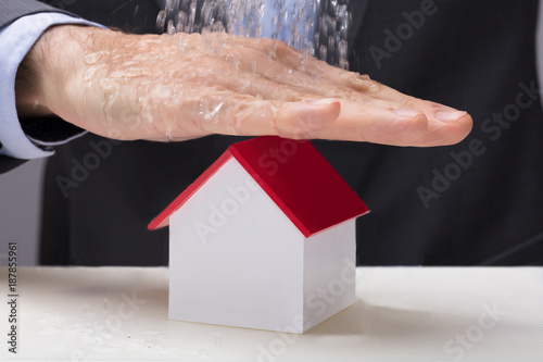 Hand Over The House Model From Falling Water