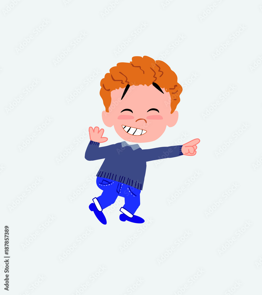 White boy in jeans pointing to something funny on his left. White boy in jeans pointing to something funny on his left.
