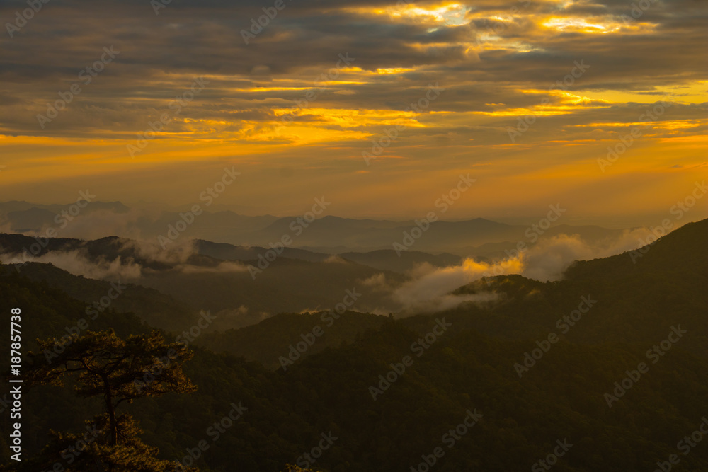 Photo landscape and sunset.The Sunset on the mountains. High  Mountain in chaingrai  province Thailand.