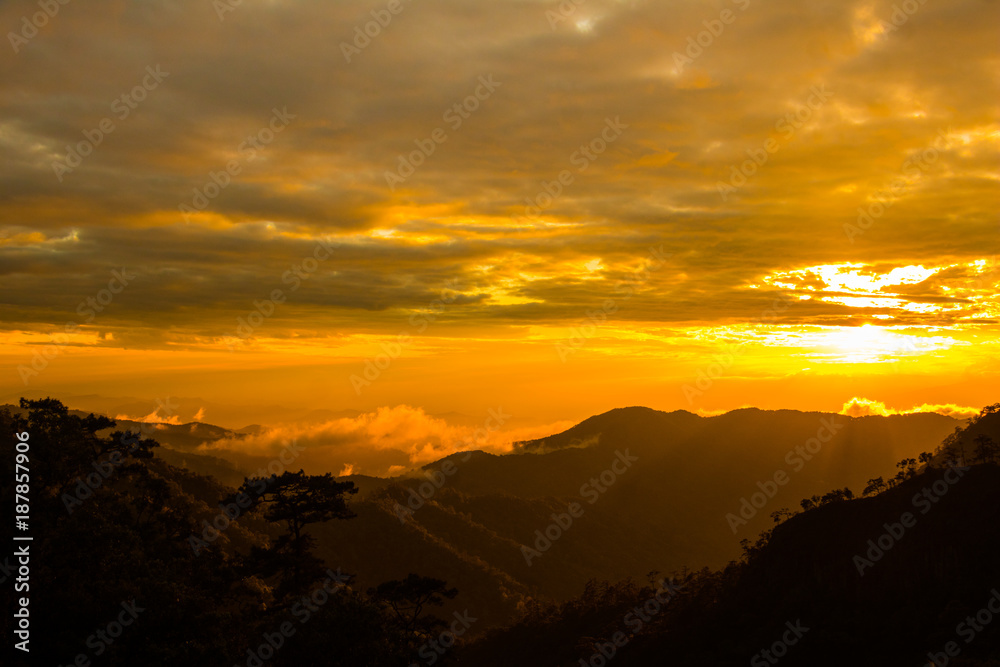 Photo landscape and sunset.The Sunset on the mountains. High  Mountain in chaingrai  province Thailand.