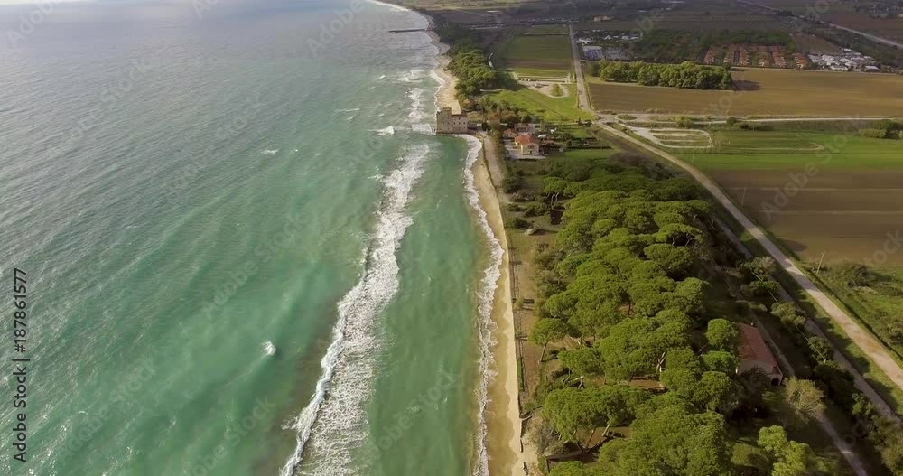 Aerial, beautiful sea shore and fields and hills on the background