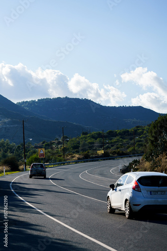 Photo of road with car in mountains © snedorez