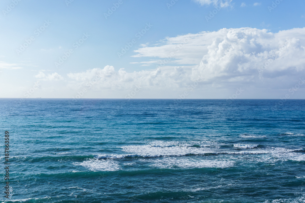 Image of blue sea and cloudy sky