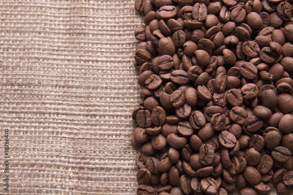 Coffee beans on burlap texture background Coffee beans on burlap texture background