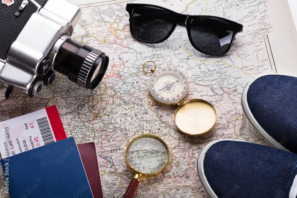 Boarding Pass Ticket, Passport And Camera On Map Boarding Pass Ticket, Passport And Camera On Map