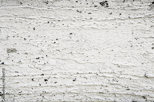 Peeling white paint on wood grunge background texture pattern for vintage design.