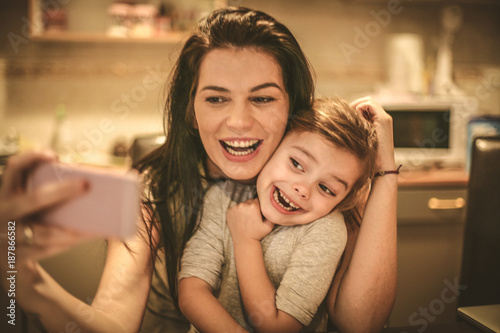 Mother take a self portrait with her little girl.