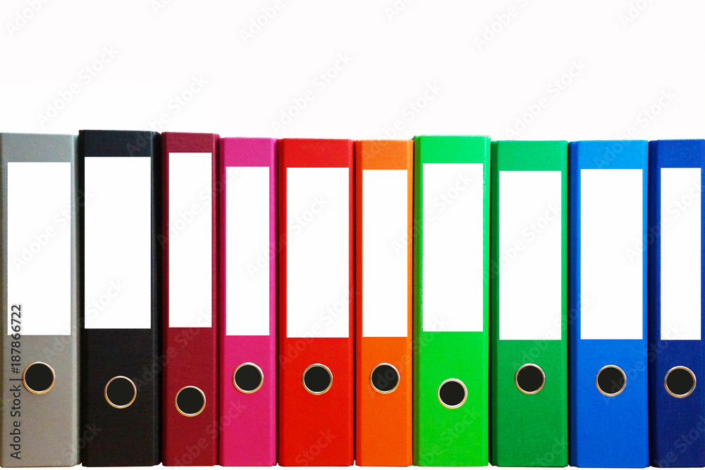 Colorful lever arch file folders in one line. Thick document cases of different colors with white fields for text and iron rings in the cover. Office stationery isolated on white background Colorful lever arch file folders in one line. Thick document cases of different colors with white fields for text and iron rings in the cover. Office stationery isolated on white background