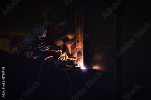 Welding steel structures and bright sparks in construction steel industry.