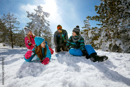 Ski, snow sun and fun - family on ski holiday