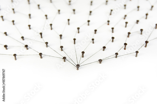 Linking entities.social media  internet communication abstract. a small network connected to a larger network. in paper linked together with copy space by cotton with a black tint