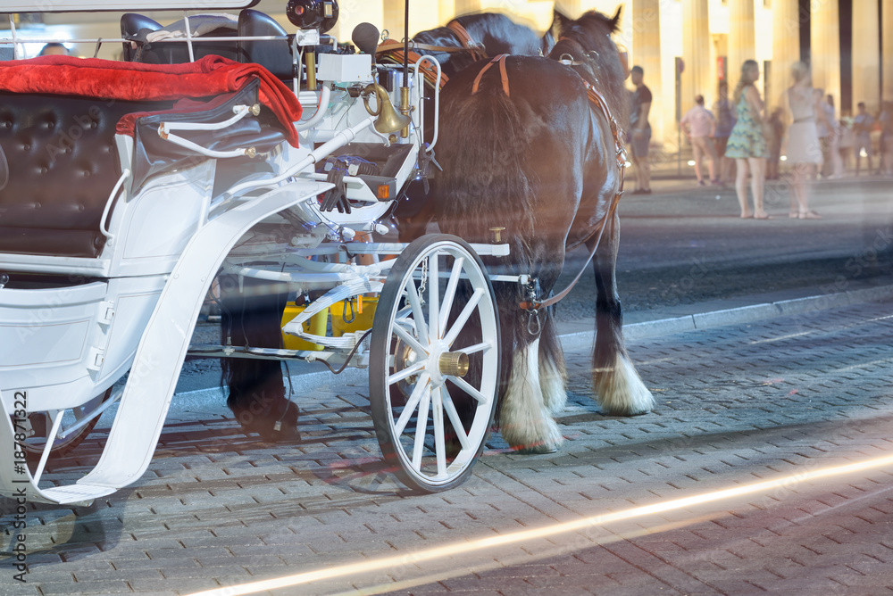 Horse carriage at night with tourists. Holiday concept Horse carriage at night with tourists. Holiday concept