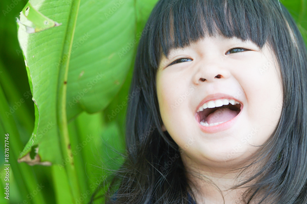 Little girl child showing front teeth with big smile: Healthy happy funny smiling face young adorable lovely female kid with new tooth dental loss: Joyful portrait of asian elementary school student Little girl child showing front teeth with big smile: Healthy happy funny smiling face young adorable lovely female kid with new tooth dental loss: Joyful portrait of asian elementary school student