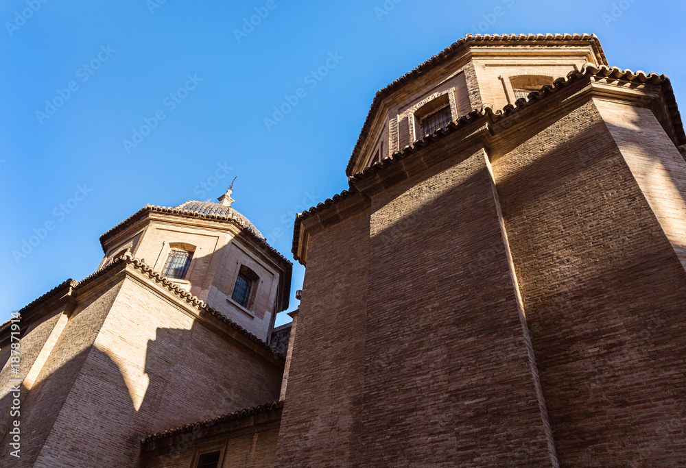 Fototapeta premium Fragment of historic building against blue sky.