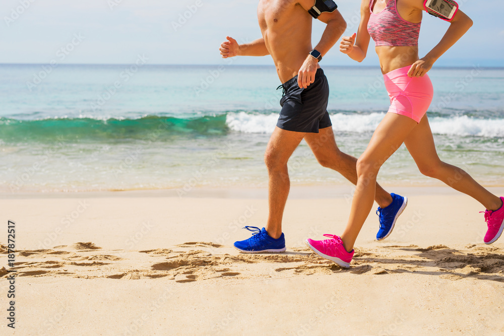 Fotografie Couple running together on the beach