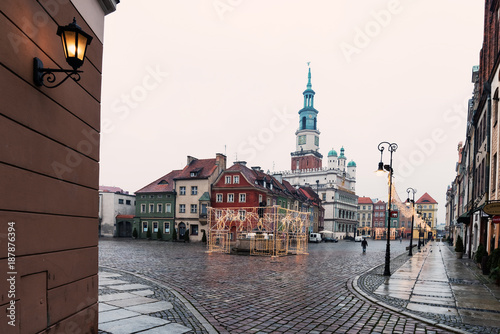 POZNAN, POLAND - JANUARY 11, 2018: Colorful ancient tenement houses and ancient Town Hall in Old Market Square, Poznan, Poland