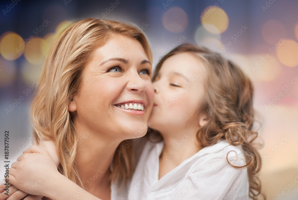 happy mother with daughter hugging and kissing happy mother with daughter hugging and kissing