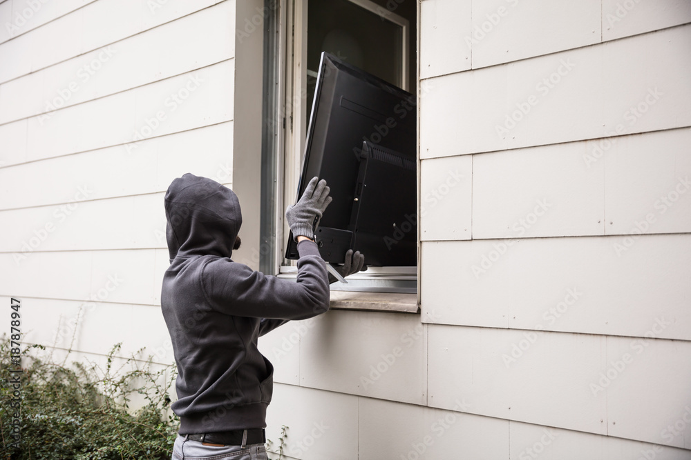Robbers Stealing Television Through House Window Robbers Stealing Television Through House Window